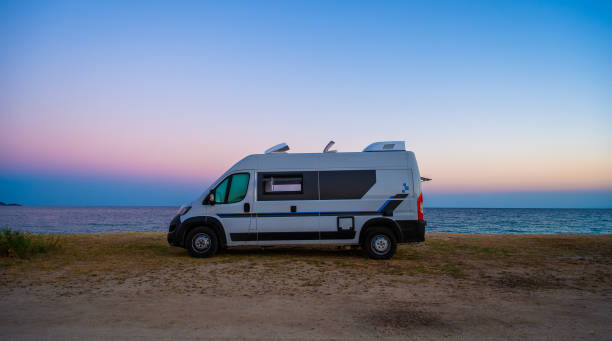 istock Campervan or motorhome parked on the beach in Greece. 2042703675
