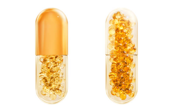 Golden oil supplement pill, a fish oil, omega-3, or vitamin E capsule for health and nutrition. Isolated on white background with clipping path.