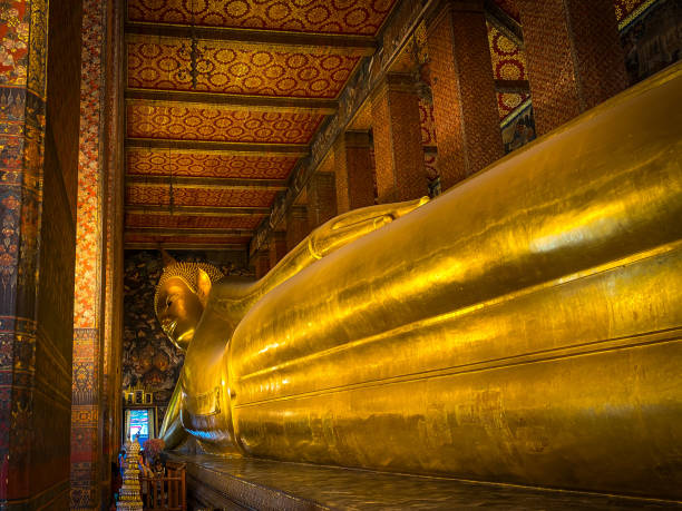 istock Wat Pho temple. Big Reclining golden Buddha statue 2042719608