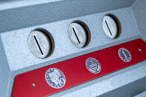 Detail of a coin-operated telephone from the 1980s, as used in Austria. Coin slot for 10, 5 and 1 Schilling.