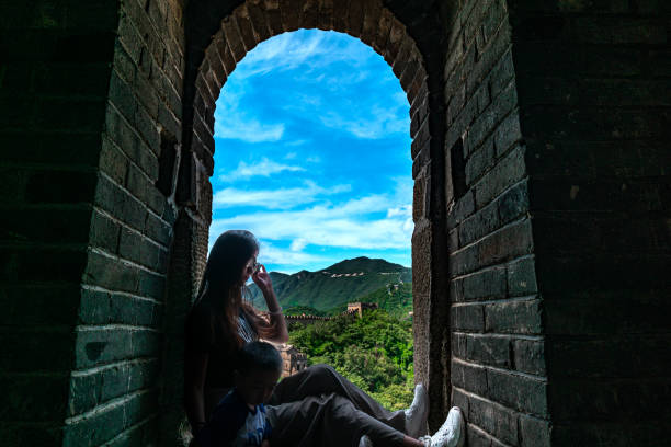A beautiful lady is playing on the Great Wall