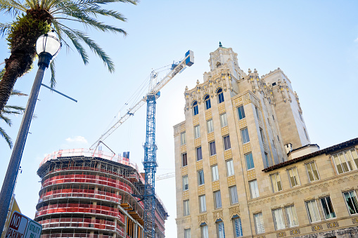 Historic building and construction site of a new high rise building in Downtown Saint Petersburg, Florida, USA.