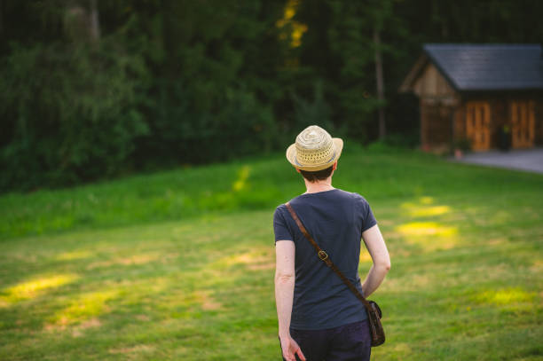 istock Woman with hat walking away 2042721463