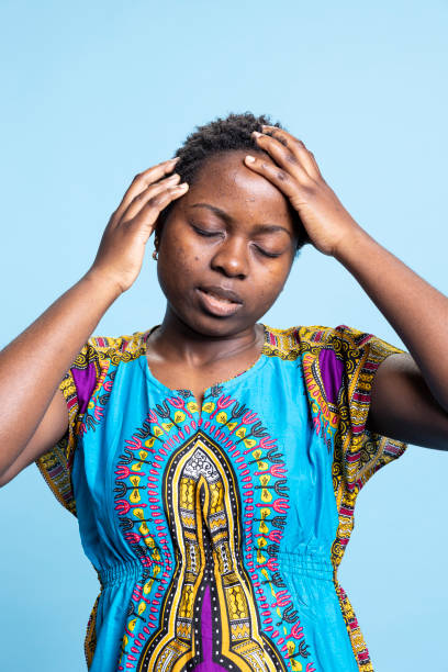istock African american person dealing with severe headache in studio, 2042752327