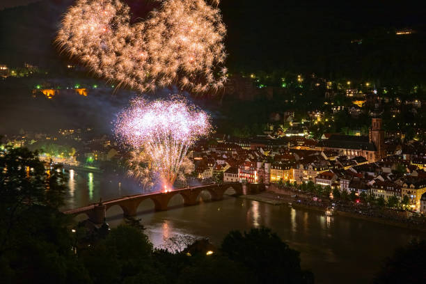 Heidelberg, Germany - May 20, 2013: Firework display at Karl Theodor Bridge. The Heidelberg Castle Lighting and Fireworks is annual event to commemorate the burning of the Heidelberg Castle by the French troops in 1693.