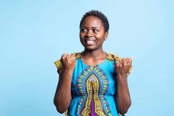 istock Joyful african american girl cheering for someone in studio 2042756689