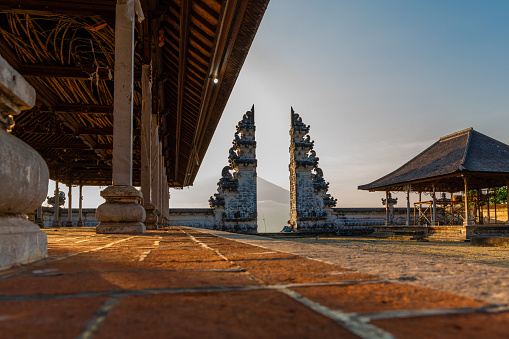 A view from inside Lempuyang Temple looking towards the Bali Gates of Heaven during sunset in Indonesia.