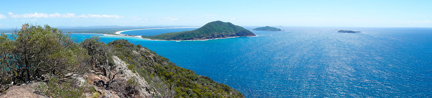 The stunning views from Tomaree Head Cliffs and Summit walk offers a short but challenging hike and picturesque ocean views across Port Stephens and beyond. \n\nWhen you reach the summit, enjoy panoramic views of Yacaaba Head, Cabbage Tree, Boondelbah and Broughton Islands from the north platform. \n\nFrom the south platform, views of Zenith, Wreck and Box Beaches, Fingal Island and Point Stephens Lighthouse will be sure to impress.It's a must-see destination if you're in the area.