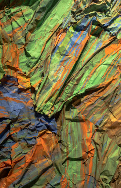 Crumpled real vivid paper background texture.