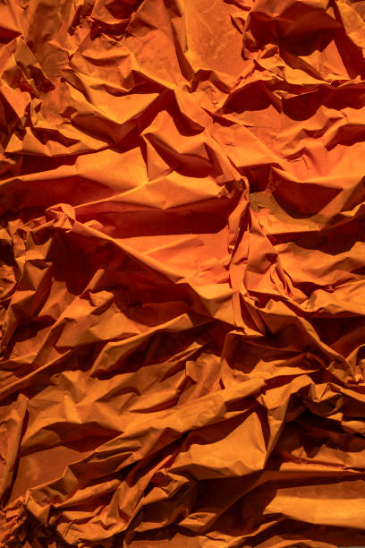 Crumpled real vivid paper background texture.