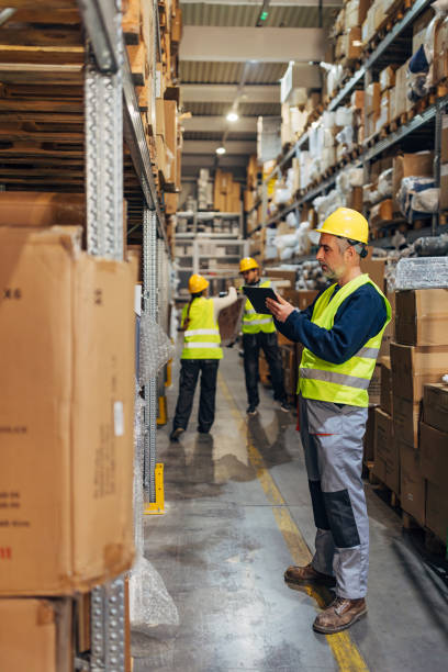istock A small group of warehouse workers prepares a shipment to be sent from the warehouse. One of the workers uses a digital tablet 2042832319