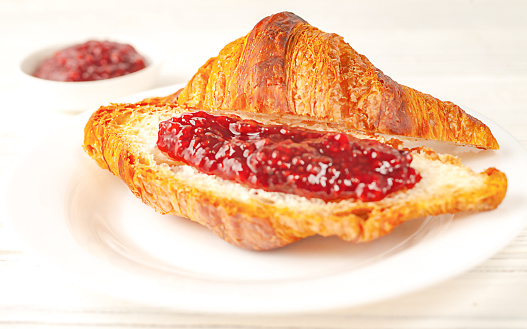 Delicious, fresh croissants with jam. French breakfast