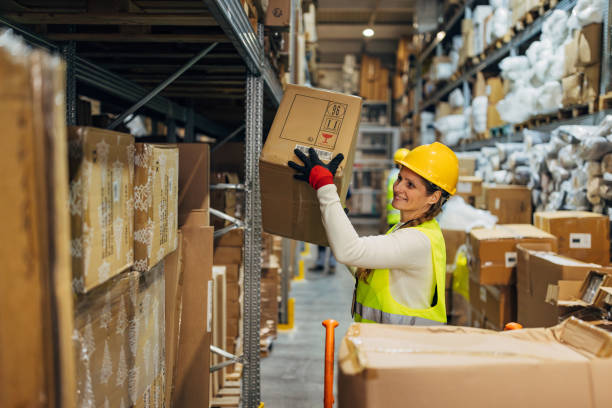 istock Small group of workers in reflective uniform work in a wholesale warehouse 2042855818