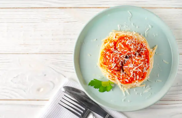 pasta with meatballs and parsley with tomato sauce