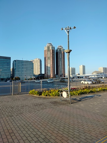 Empty Parking Lot with Tall Buildings in the Background