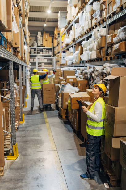 istock Teamwork of a group of warehouse workers 2042874164