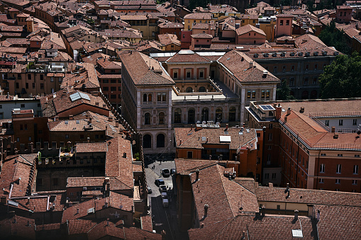 a top view of the terracotta roofs of Bologna, the atmosphere of the Italian summer