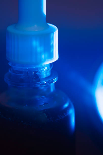 Skin care serum in a blue jar with a pipette. High quality photo