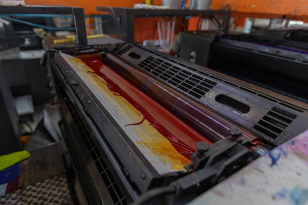 istock Offset printing machines. Large printing machine perspective. printing machine cylinders and printing ink pot. Offset machine. Offset press is a printing machine designed to produce fine quality 2042922455