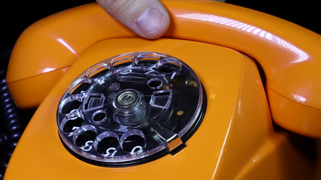 Old orange telephon, close up