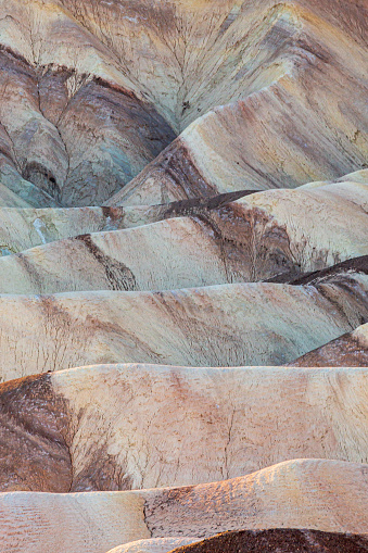 A full frame photograph of rock formations at Zabriskie Point in Death Valley