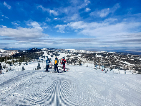 Brian Head, Utah, USA- February 19, 2024: Skiers standing at the top of the mountain, Brian Head ski resort, Utah.