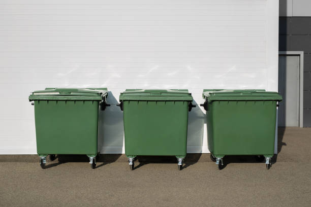 istock Three green dumpsters on the street. Garbage bin. 2042974216