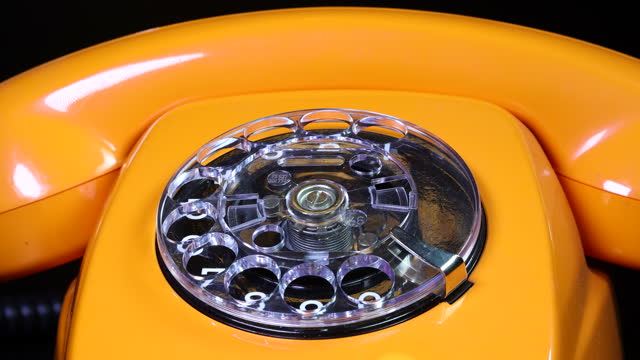 Old orange telephon, close up