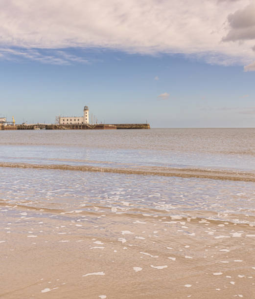 istock Scarborough beach and lighthouse. 2042993400