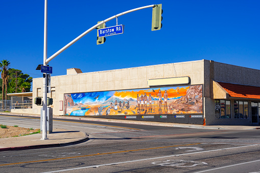 Barstow, California, United States - August 31, 2023: Mural on a building in Barstow, along Route 66 and Barstow Road, representing historic indigenous people.