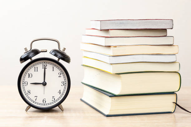 istock A stack of books and an alarm clock. 2043003483