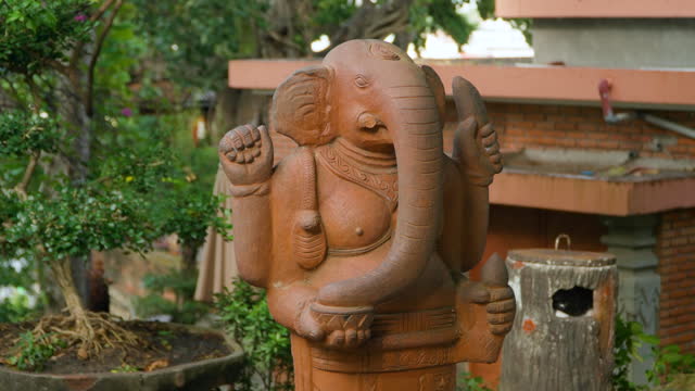 Orange Ganesha or Ganapati Statue in Po Nagar Cham Temple Garden, Nha Trang, Vietnam