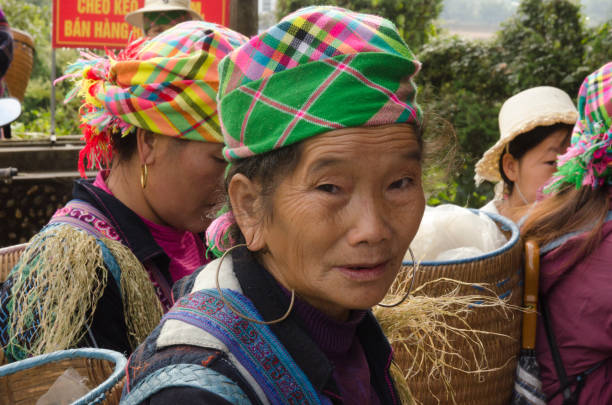 Kut Hing Wei, Hongkong - February 16, 2006: An old hokkien woman wearing traditional clothes in Kut Hing Wei. Hokkien (or hakka) is a minority living in the south part of China and Hongkong. Their typical dress is normally dark color including a special hat for the ladies. They have a different language as well.