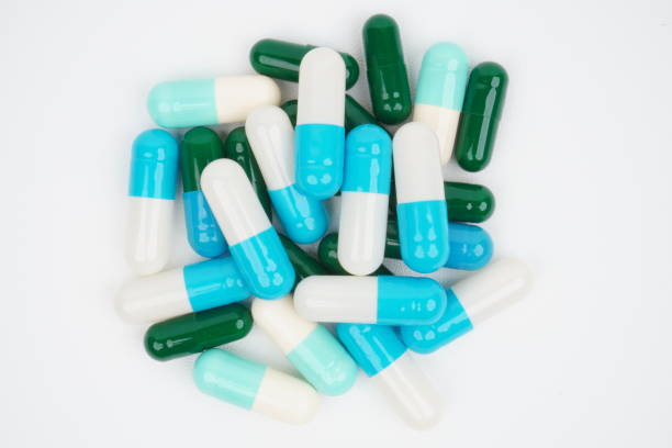 istock top view of assorted colors of pill capsules on white background 2043038018