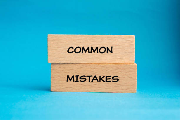 istock Common mistakes words written on wooden blocks with blue background 2043040784