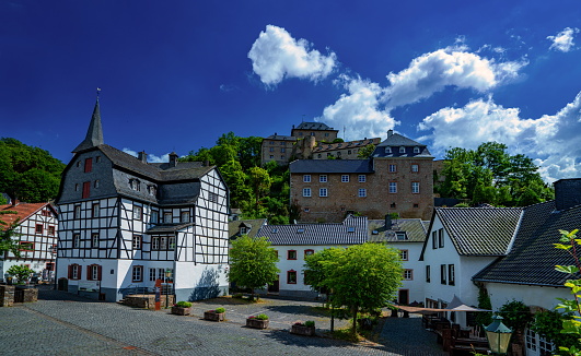 Hallstatt, Austria - June 7, 2023: Beautiful landscape of the Hallstatt town, Austria in sunny summer day.