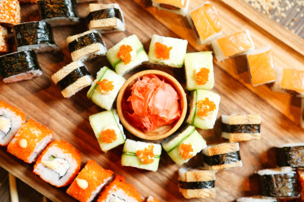 istock Assorted Sushi on Wooden Cutting Board 2043070480