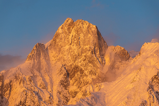 The granite peak of Sasso Manduino in Valchiavenna at sunset
