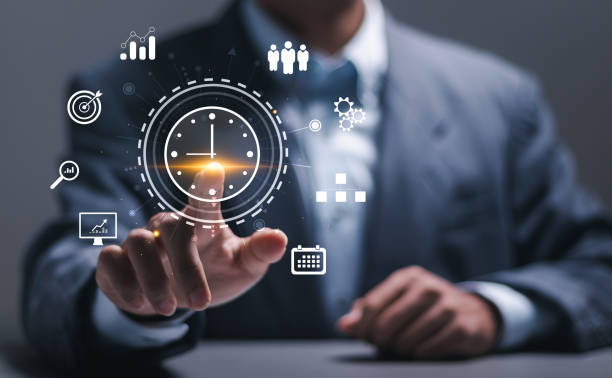 istock Time management concept. Businessman touching clock icon on virtual to work planning for increases efficiency and reduces work time. Business project planning. 2043096959