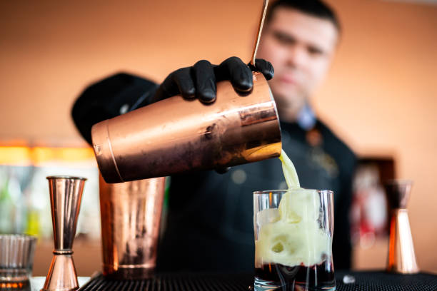 istock Close-up of bartender preparing a drink at bar 2043098531
