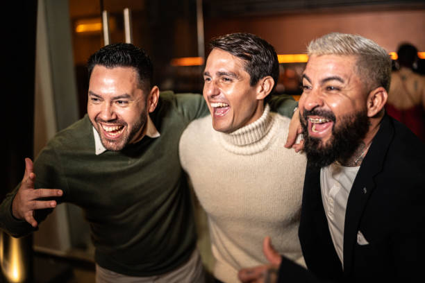 Friends embracing and having fun on a nightclub