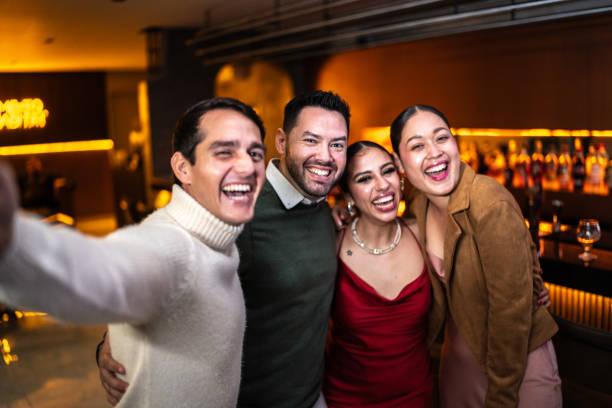 istock Friends having fun and taking a selfie at bar - Camera point of view 2043107048