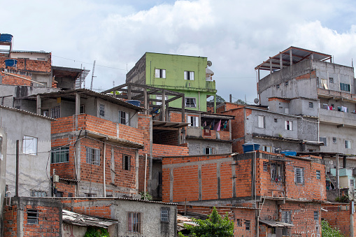 View of shacks in a favela in the middle of the Atlantic Forest. Fragile buildings on the outskirts of São Paulo, Brazil.