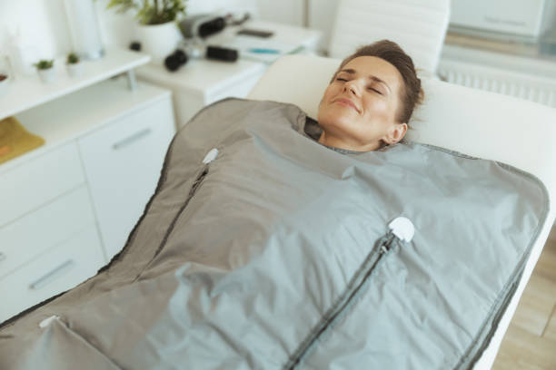 istock woman doing whiskey swaddling procedure in thermal blanket 2043128908