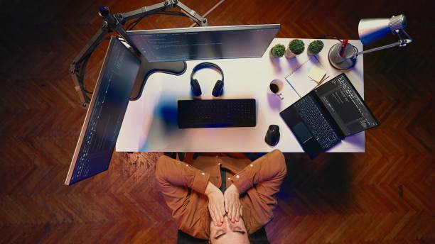 istock Tired IT admin exhausted from long screen time, pausing to rest, aerial shot 2043145322