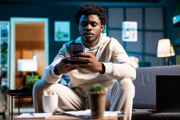 istock Man impatiently texting friend, telling him personal details 2043157571