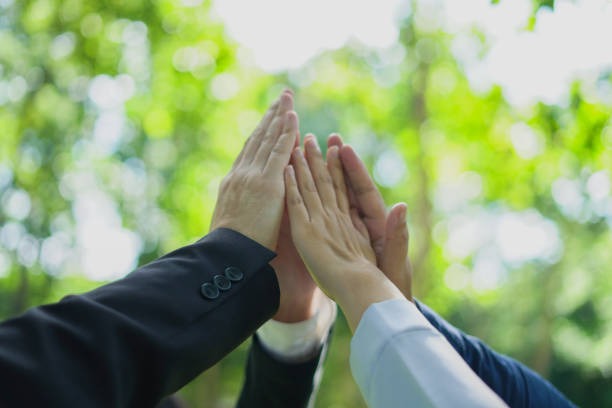 Strong hand group business cooperation success. partnership join for CSR and ESG cooperation Global community teamwork, environmental energy-saving cooperation for the Sustainable Development Goals.