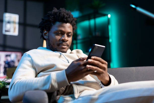 istock Smiling man impatiently texting friend, planning meeting hour together 2043162303