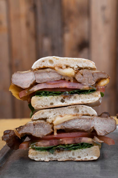 istock A sliced in half gourmet pork steak sandwich 2043182279