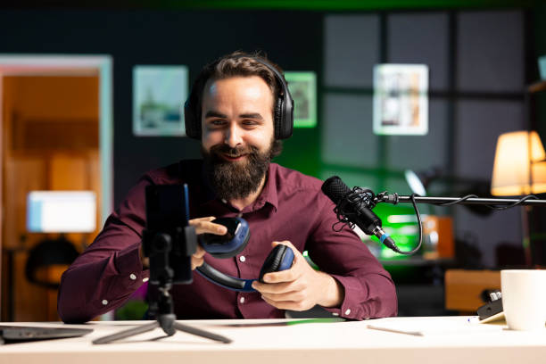 istock Content creator excited about newly launched headphones, feeling impressed by high quality audio 2043185943